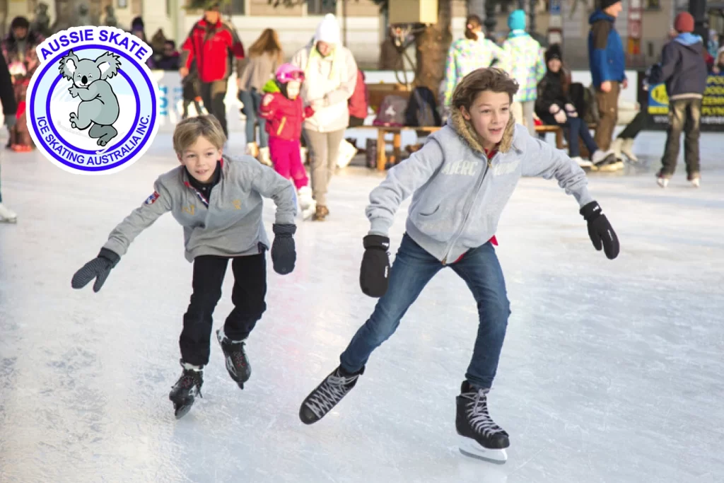 Two children are skating on an ice rink.